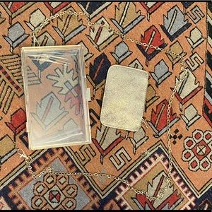 Cute acrylic box clutch with gold clasp, detachable chain strap, and pouch.